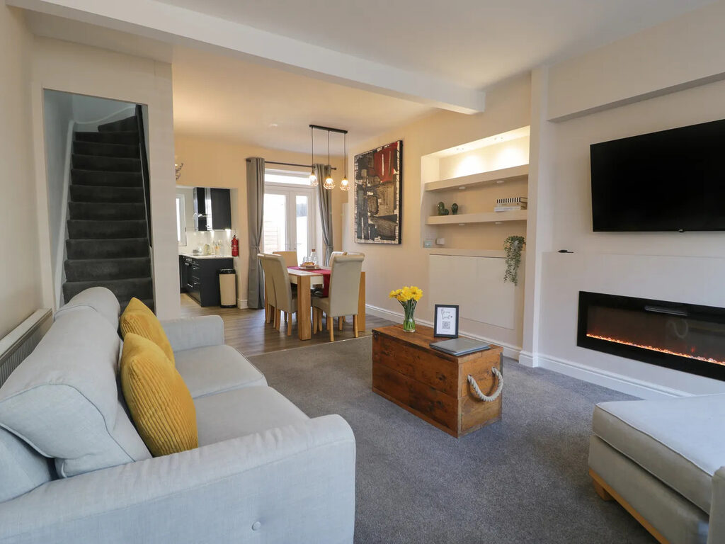 Llandudno Central Townhouse living room looking through to the dining area and stairs
